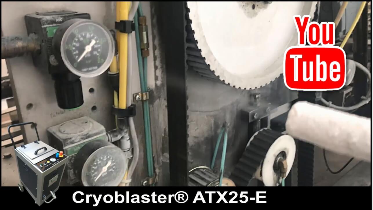 Industrial equipment with gauges and gears, a small dry ice blasting machine sits in the foreground, YouTube logo visible.